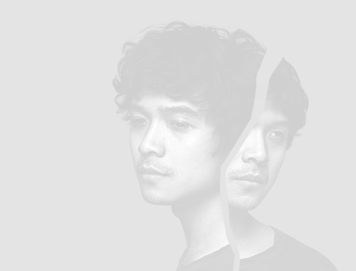A black and white portrait of a young man - asian