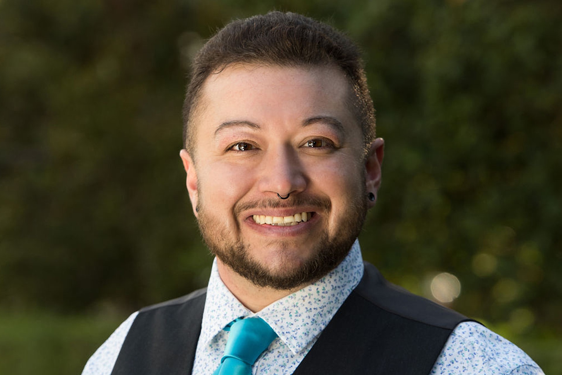 headshot of the article's author, Dannie Ceseña, who is a Program Coordinator with the California LGBTQ Health and Human Services Network