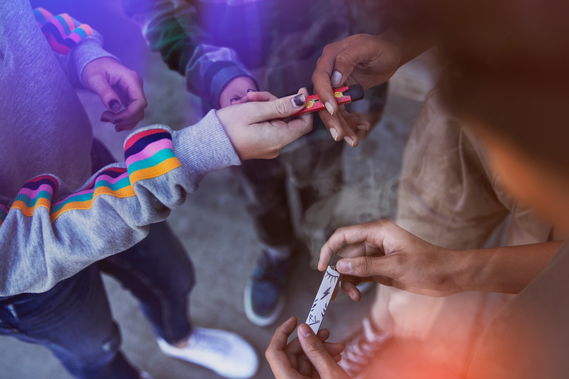 Vapes being passed around teenage friends