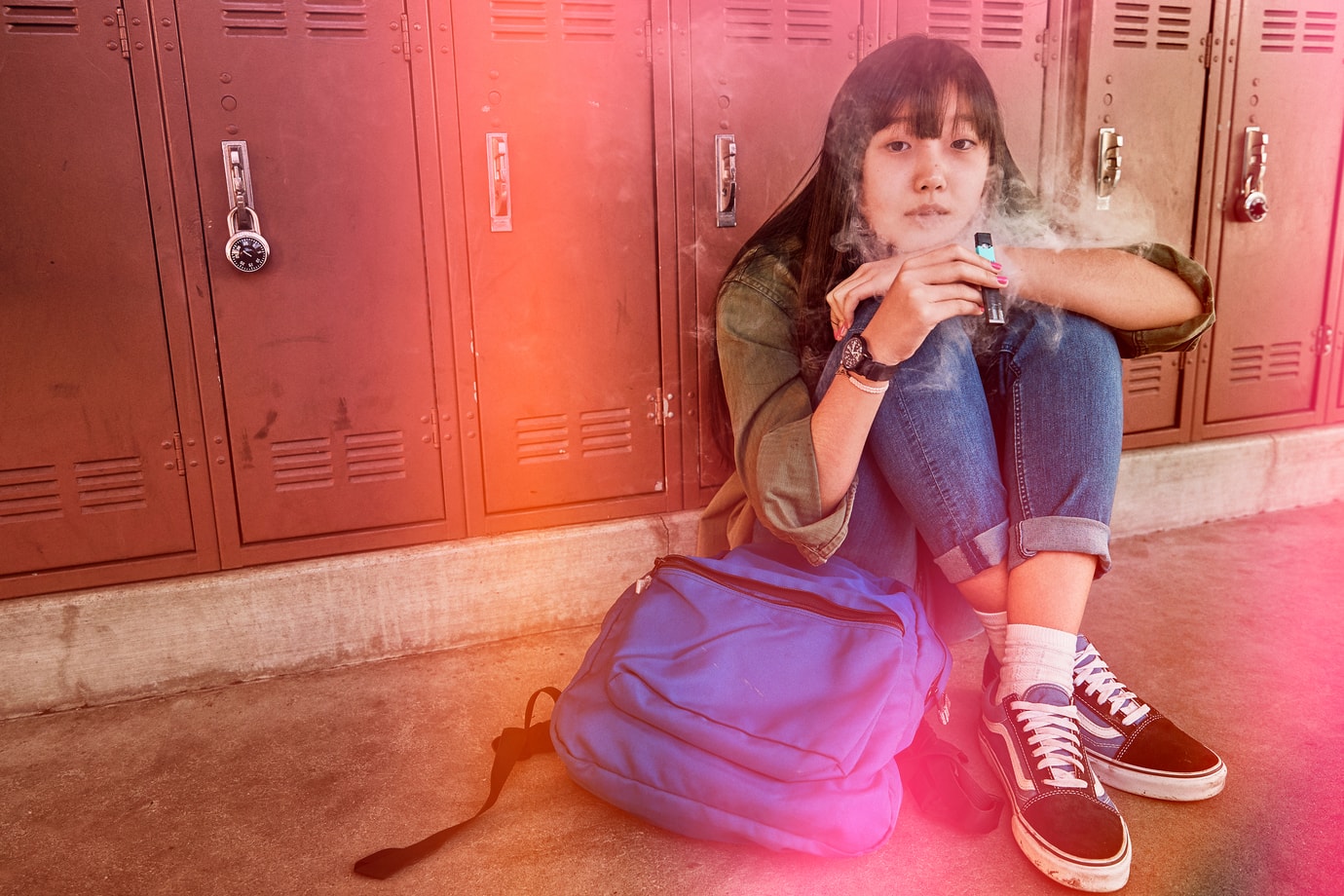 Young girl smoking a vape