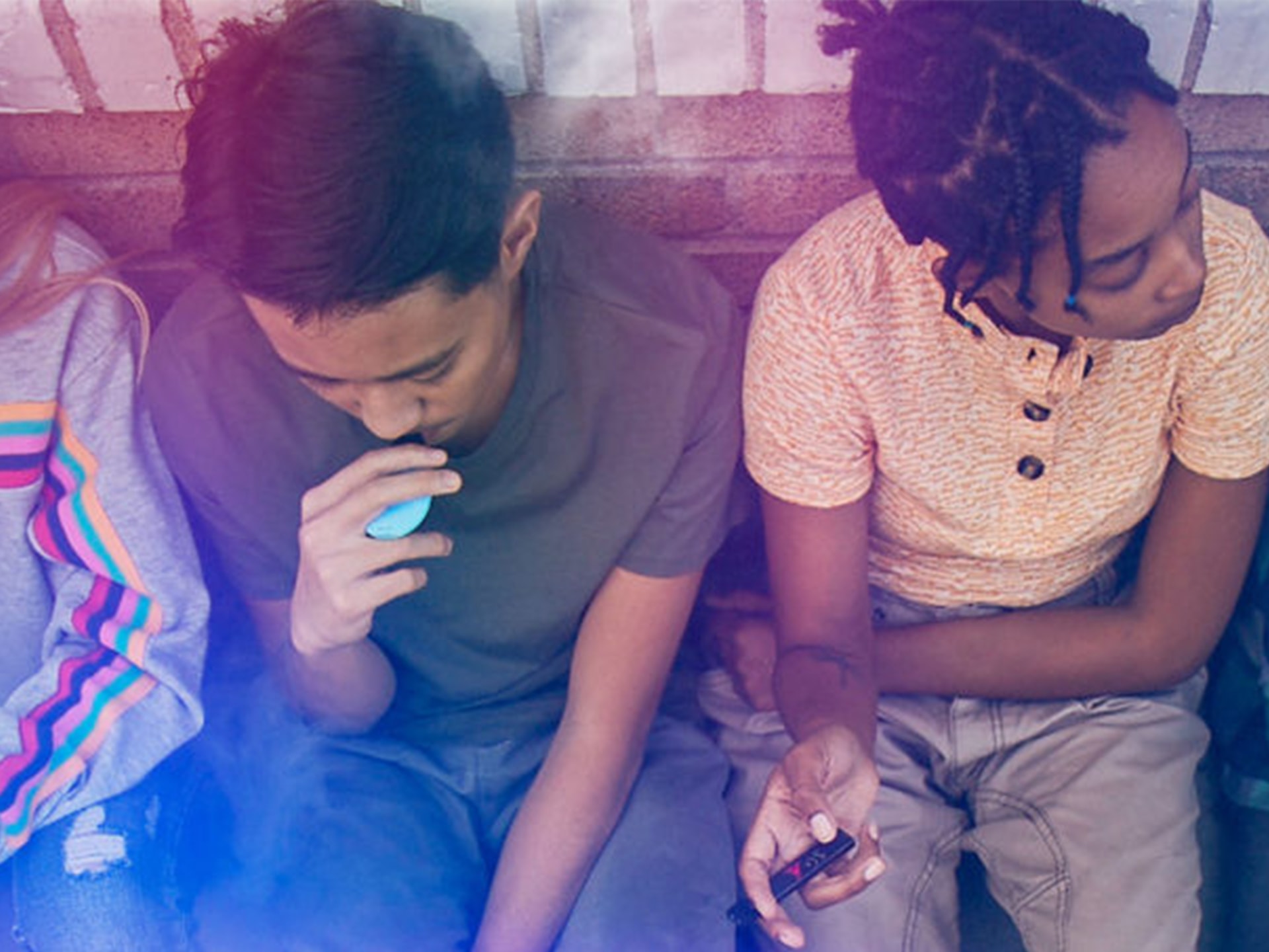 a group of kids vaping