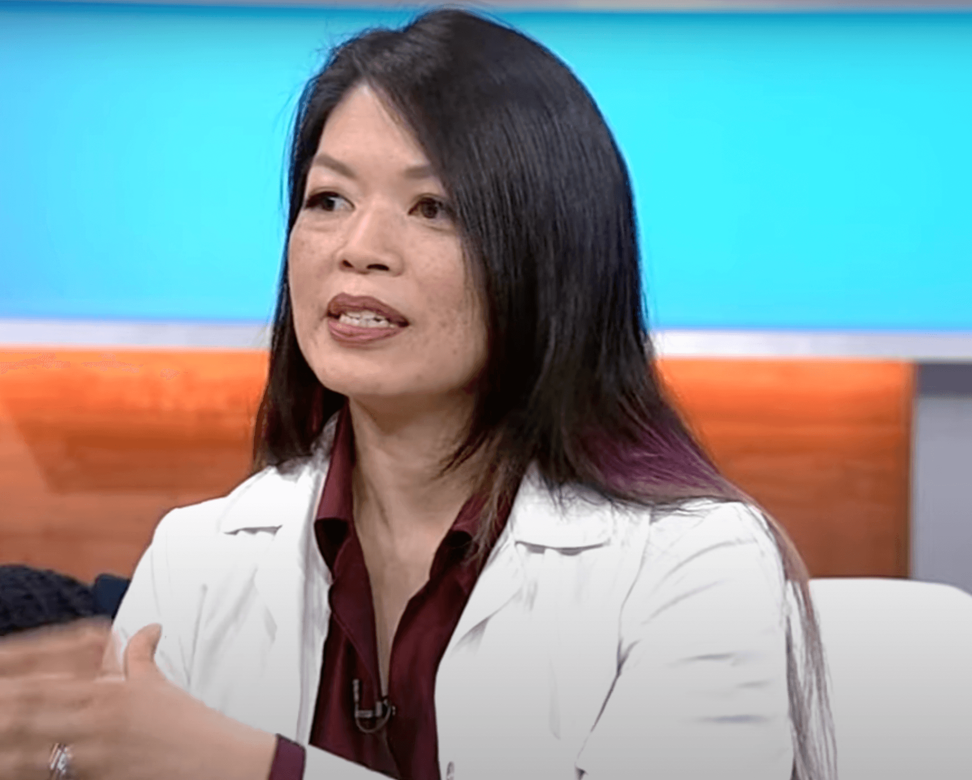 Dr. Pam Ling speaking in the middle of a discussion