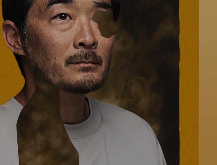 A portrait of a man with missing parts that's been replaced with smoke