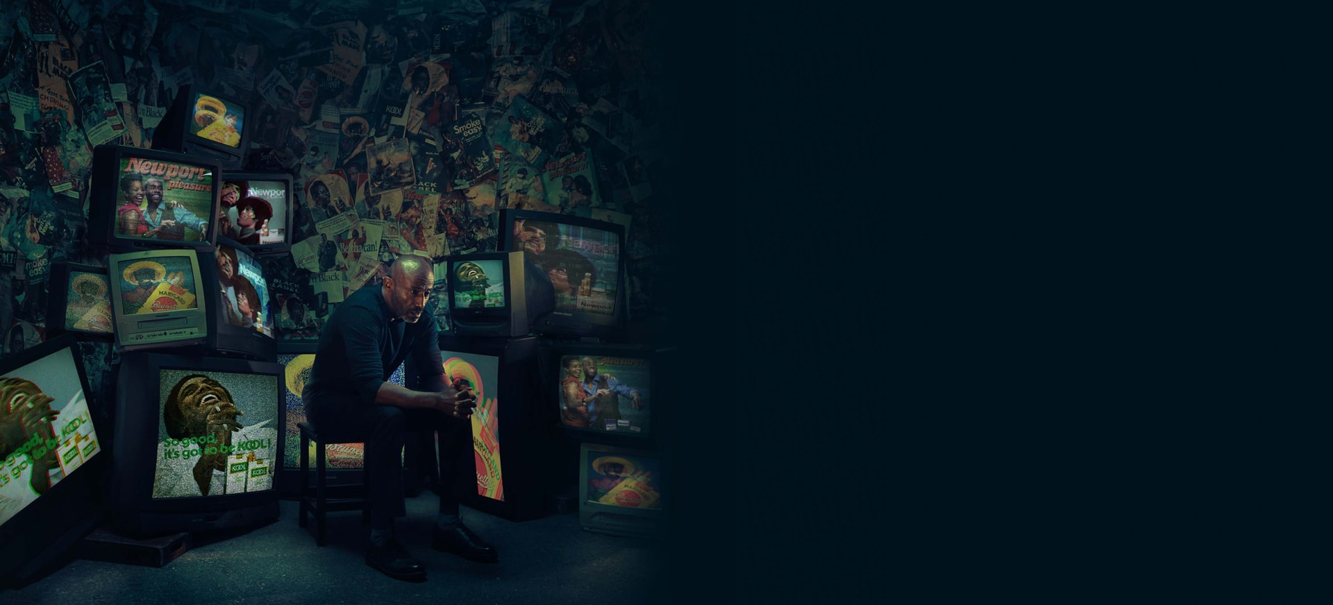 An African American/Black man sitting on a chair watching cigarette ads