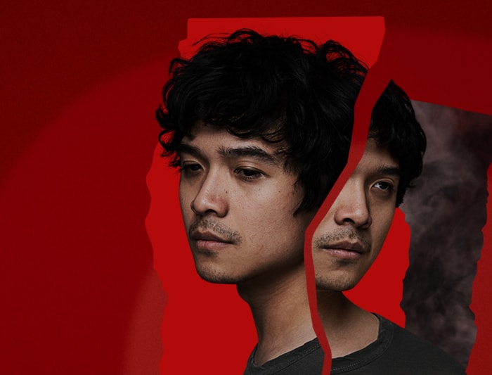 A distorted portrait image of a young asian male